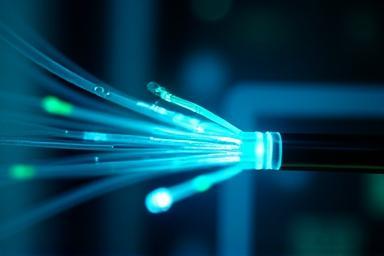 Close-up of glowing fiber optic cables.